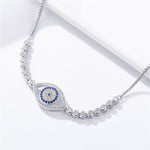 Load image into Gallery viewer, Protection of Nazar Elegance Bracelet Zoomed on Nazar Boncuk Evil Eye Symbol and River Stones in decorated environment
