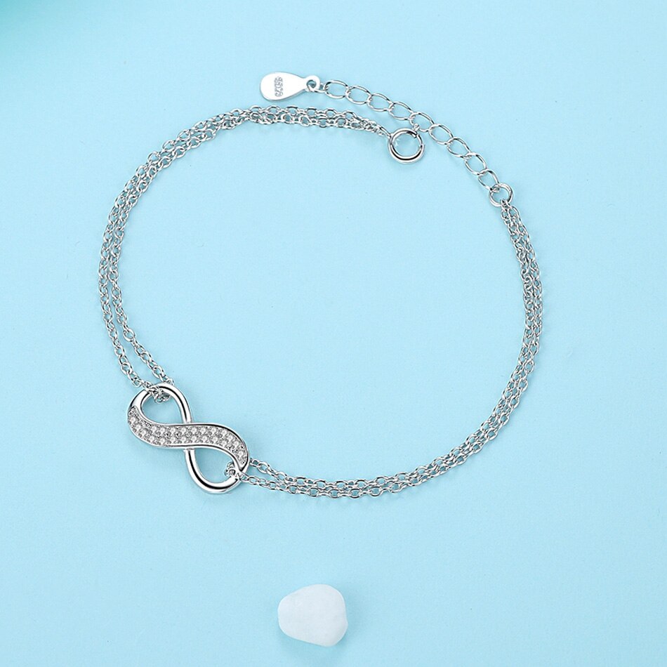 Serenity of Eternal Unity Elegance Bracelet in decorated environment positioned in O shape flat seen from top